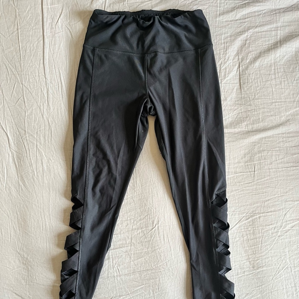 Black high rise leggings with cut outs in the sides